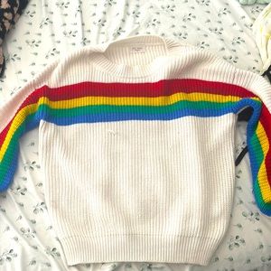 Adorable sweater looks retro with rainbow lines